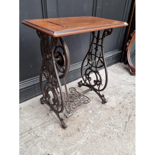 1134 - A late 19th century Willcox & Gibbs cast iron sewing machine base, 63cm wide.... 