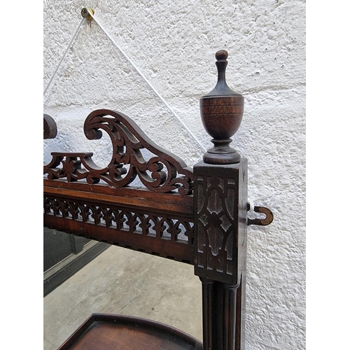 1106 - A small early 20th century mahogany mirror back hanging shelf, with fretwork decoration, 67 x 3... 