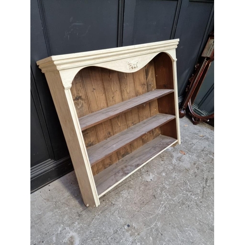 1123 - A painted pine hanging open bookcase, 95.5cm high x 92cm wide.