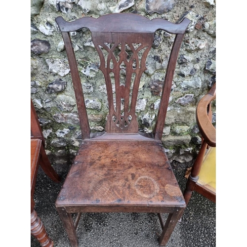 1131 - An 18th century oak dining chair; together with a circa 1900 carved mahogany hall chair; and an... 