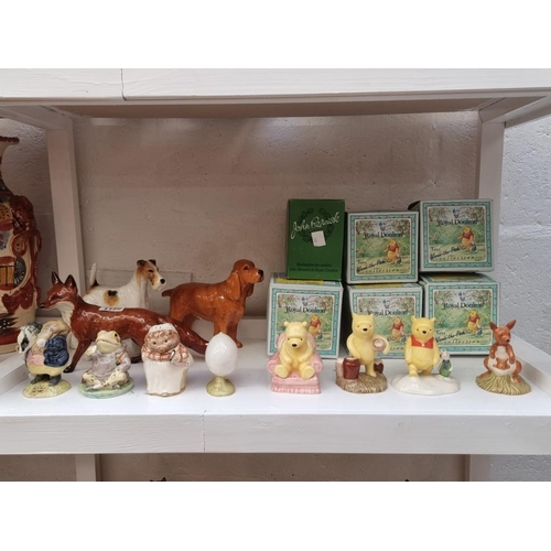 1150 - Three Beswick animals, largest 25cm long; together with five Royal Doulton 'Winnie-the-Pooh' collect... 