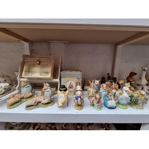 1157 - A collection of Beswick 'Beatrix Potter' figures; together with other Beatrix Potter items and simil... 