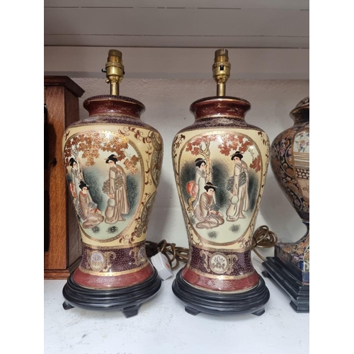 1192 - Two pairs of Japanese Satsuma pottery table lamps, total height of largest 46cm. ... 