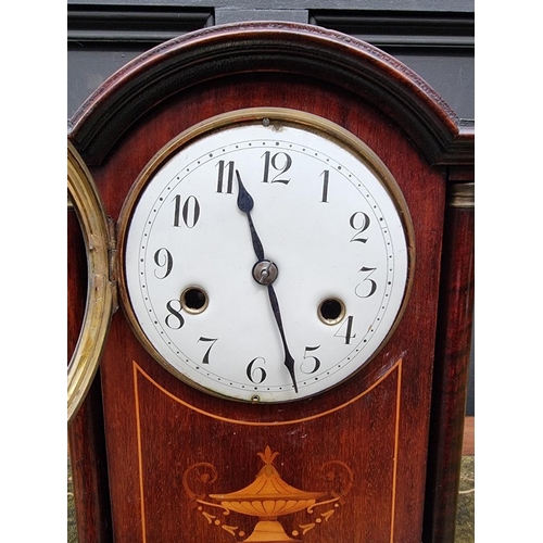 1194 - An Edwardian mahogany and inlaid mantel clock, 32cm high, with pendulum. 