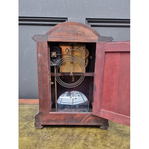 1194 - An Edwardian mahogany and inlaid mantel clock, 32cm high, with pendulum. 