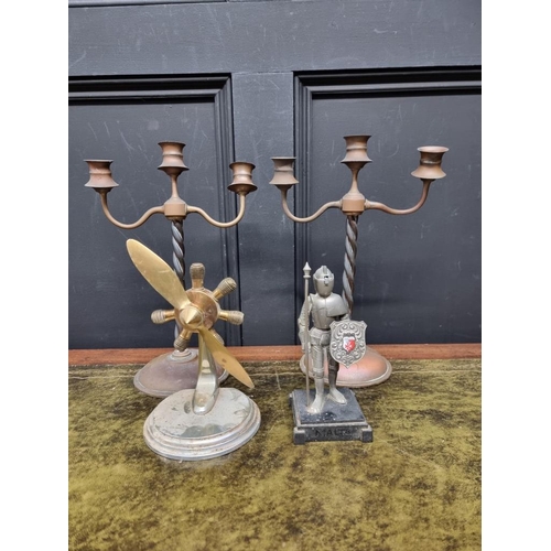 1208 - A pair of brass candelabra, 32cm high; together with a novelty knight lighter; and one other. (4)&nb... 