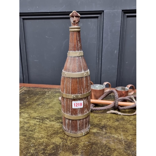 1219 - An unusual staived oak and brass bound bottle, 32cm long; together with a matched part set of four c... 