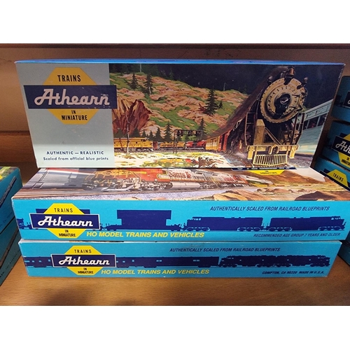 1438 - A collection of Athearn HO gauge railway, comprising: eight locomotives and sixteen coaches and frei... 