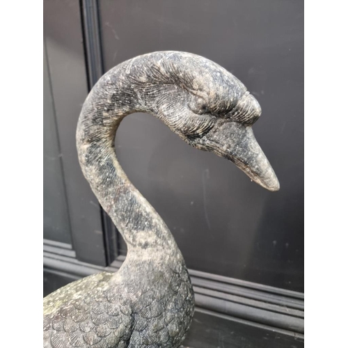 1233 - A life-sized aluminium goose, 60cm high; together with another similar large fish, 58cm high. (2)... 