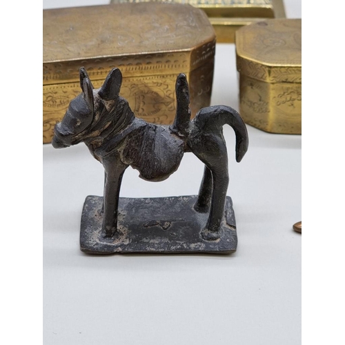 1239 - A mixed group of metalware, to include: a small pair of brass dogs, 9.5cm wide. (6)