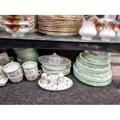 1267 - A Minton 'Haddon Hall' pattern part tea and dinner service, (isolated minor damage).... 