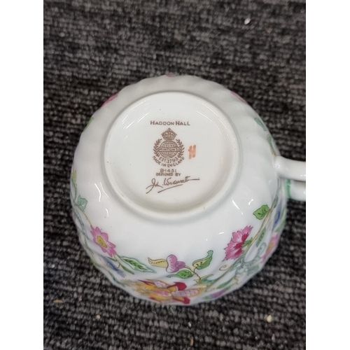 1267 - A Minton 'Haddon Hall' pattern part tea and dinner service, (isolated minor damage).... 