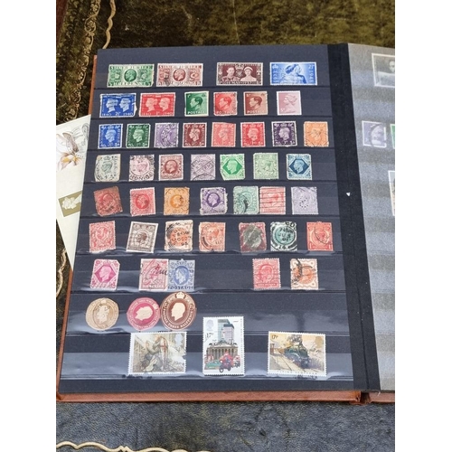 1313 - Stamps: a mixed world stock book; together with an early 20th century album of cigarette cards, to i... 