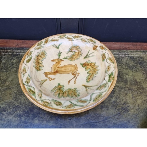 1337 - Studio Pottery: a slipware charger and matching bowl, the charger painted with a deer, 41.5cm diamet... 