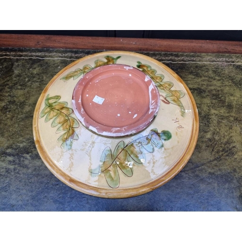 1337 - Studio Pottery: a slipware charger and matching bowl, the charger painted with a deer, 41.5cm diamet... 