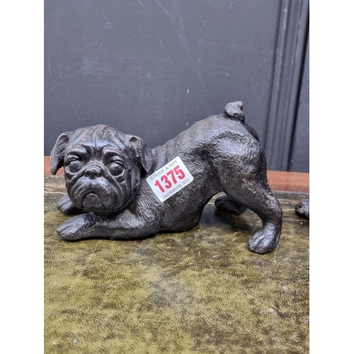 1375 - A bronze Pug, 18cm long; together with a bronze Bulldog, 19cm high; and a similar cat, 12.5cm wide. ... 