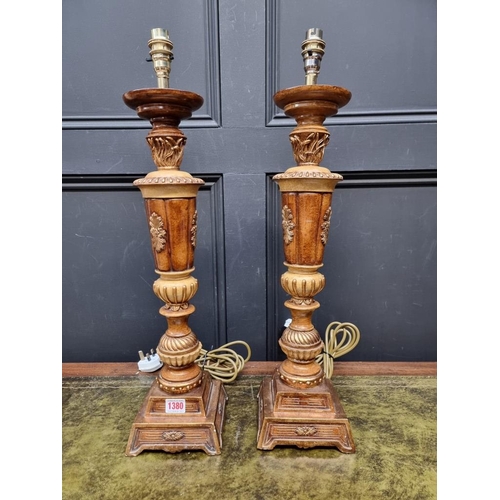 1380 - A large pair of parcel gilt composition table lamps, total height 61cm. (2)