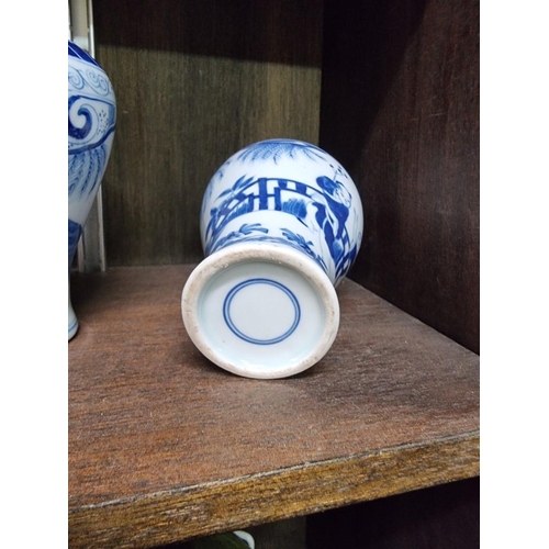 1386 - A collection Chinese and Japanese blue and white vases, largest 14cm high. (8)