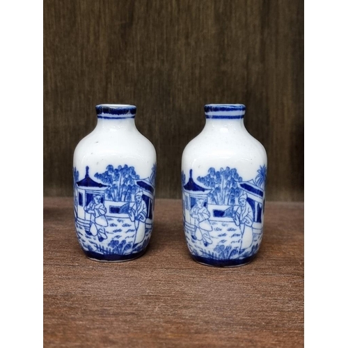 1386 - A collection Chinese and Japanese blue and white vases, largest 14cm high. (8)