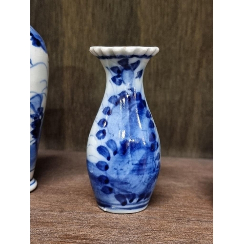 1386 - A collection Chinese and Japanese blue and white vases, largest 14cm high. (8)