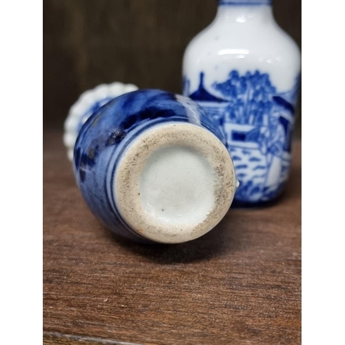 1386 - A collection Chinese and Japanese blue and white vases, largest 14cm high. (8)