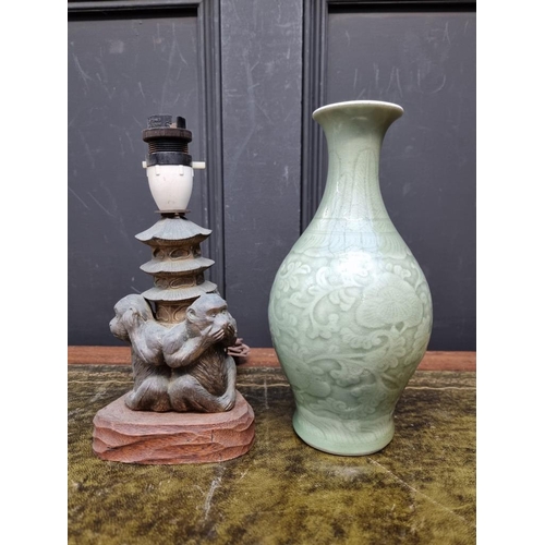 1396 - A Chinese celadon vase, 23cm high; together with a gilt metal 'Three Wise Monkeys' table lamp, total... 