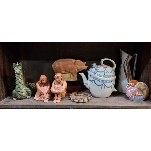 1414 - A mixed lot, to include a Wedgwood patent SYP teapot and cover; and a pair of terracotta figures by ... 