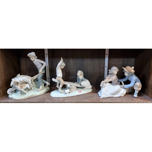 1427 - Three Lladro figure groups, comprising: 'For Me'; 'Gardener in Trouble'; and 'Seesaw'.... 