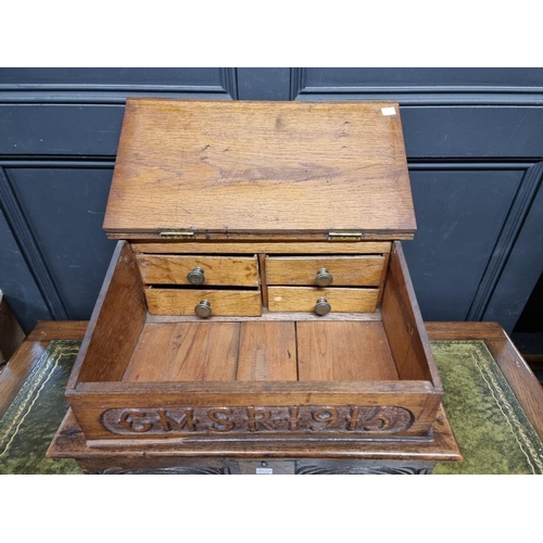 1028 - A late 17th century carved oak bible box, 56cm wide, (faults and repairs); together with another oak... 