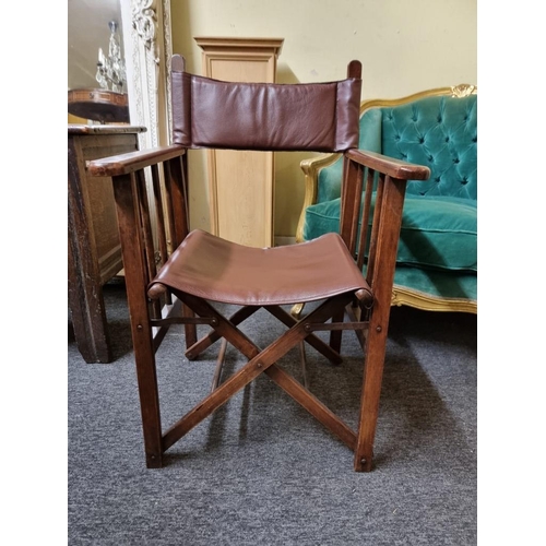 1083 - A mahogany and burgundy leather folding director's chair. ... 