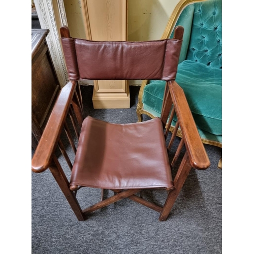 1083 - A mahogany and burgundy leather folding director's chair. ... 