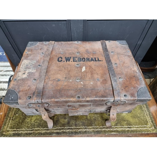 1226 - A large tan leather suitcase, with brass corners, 80cm wide. 