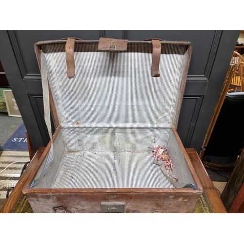 1226 - A large tan leather suitcase, with brass corners, 80cm wide. 