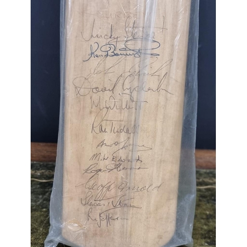 1441 - Cricket: an autographed cricket bat, circa 1964, inscribed with signatures from Australia, Surrey, K... 