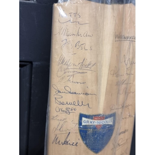 1441 - Cricket: an autographed cricket bat, circa 1964, inscribed with signatures from Australia, Surrey, K... 