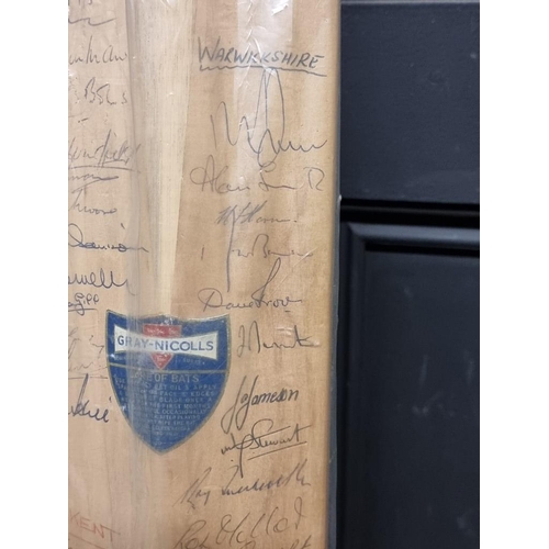 1441 - Cricket: an autographed cricket bat, circa 1964, inscribed with signatures from Australia, Surrey, K... 