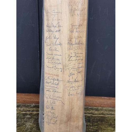 1441 - Cricket: an autographed cricket bat, circa 1964, inscribed with signatures from Australia, Surrey, K... 