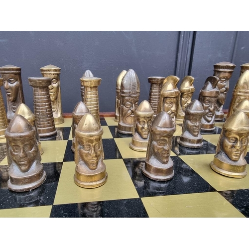 1338 - A brass chess set, king 8cm, pawn 4.2cm, with oak and brass board, 42cm.... 