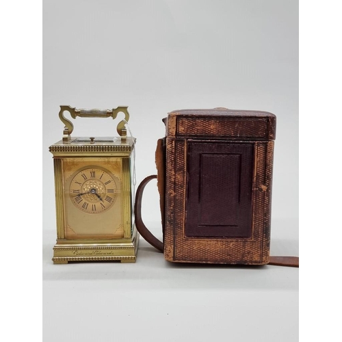 1445 - A good antique brass carriage clock, with push button repeat and gong strike, height including handl... 