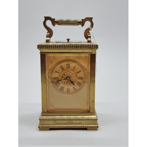 1445 - A good antique brass carriage clock, with push button repeat and gong strike, height including handl... 