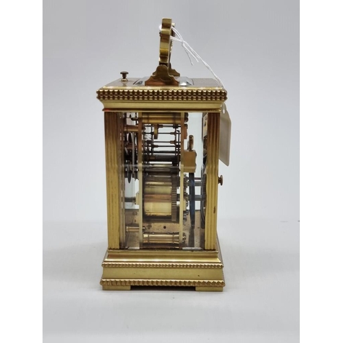 1445 - A good antique brass carriage clock, with push button repeat and gong strike, height including handl... 