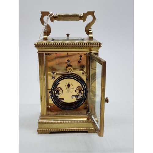 1445 - A good antique brass carriage clock, with push button repeat and gong strike, height including handl... 