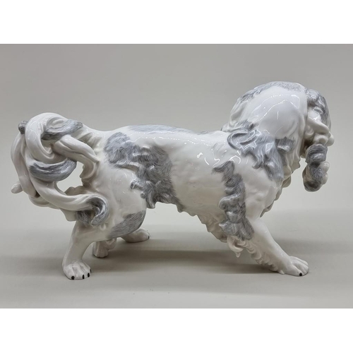 1447 - A Dresden porcelain Pekingese dog, 35cm long.