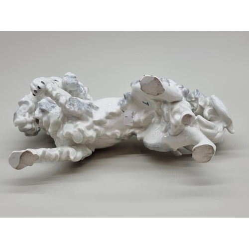 1447 - A Dresden porcelain Pekingese dog, 35cm long.