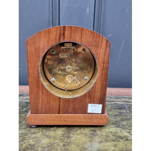 1460 - A small 1930s figured walnut mantel clock, the silvered dial inscribed 'Mappin & Webb Ltd', 17cm... 