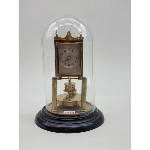 1462 - A brass anniversary clock, with glass dome, 29cm high.