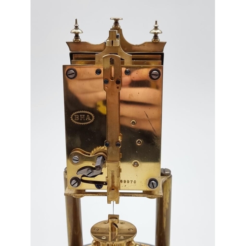 1462 - A brass anniversary clock, with glass dome, 29cm high.