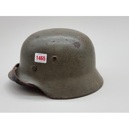 1465 - A World War II German M-35 helmet. 