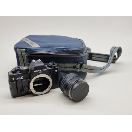 1491 - Cameras: a Praktica BX20 35mm, with three lenses, flash unit and instruction manual, in original cas... 