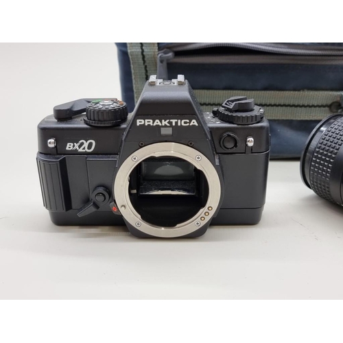 1491 - Cameras: a Praktica BX20 35mm, with three lenses, flash unit and instruction manual, in original cas... 